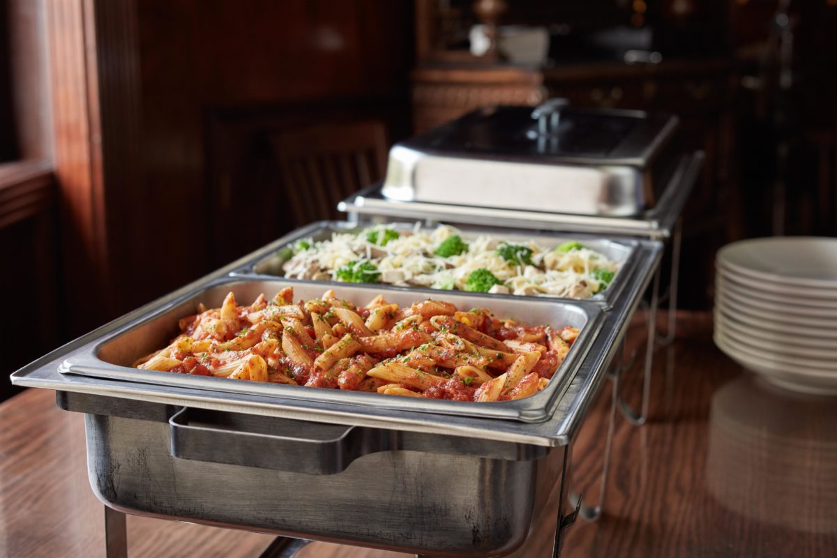 catering trays filled with pasta