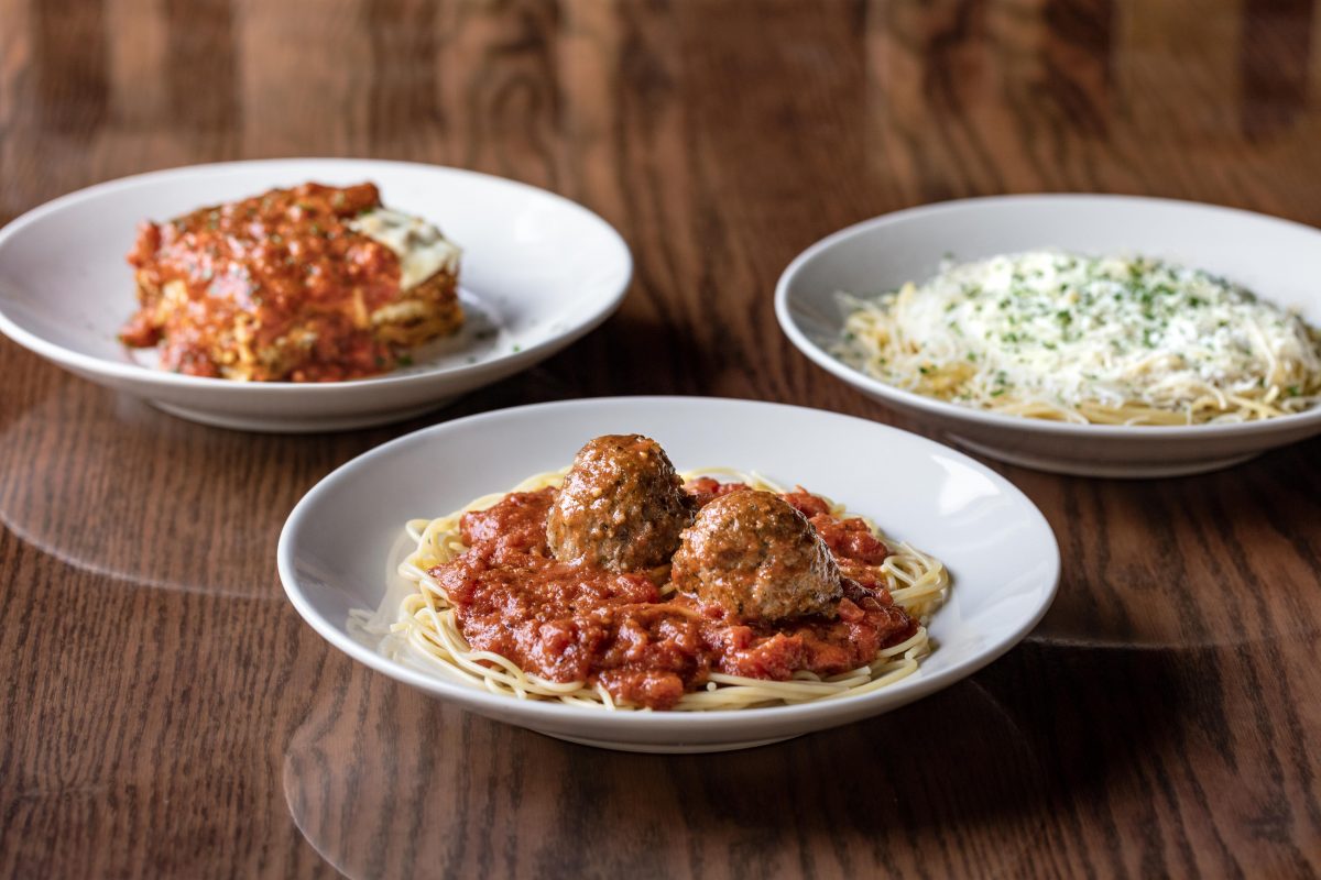 three plates: lasagna, spaghetti and meatballs, and mizithra pasta at The Old Spaghetti Factory