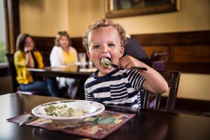 child eating pasta at The Old Spaghetti Factory