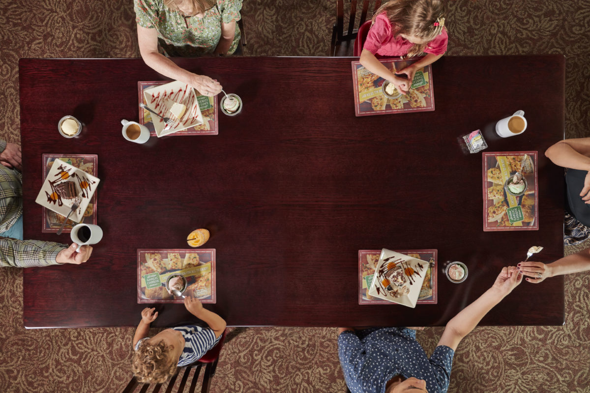 overhead view of family eating at Old Spaghetti Factory