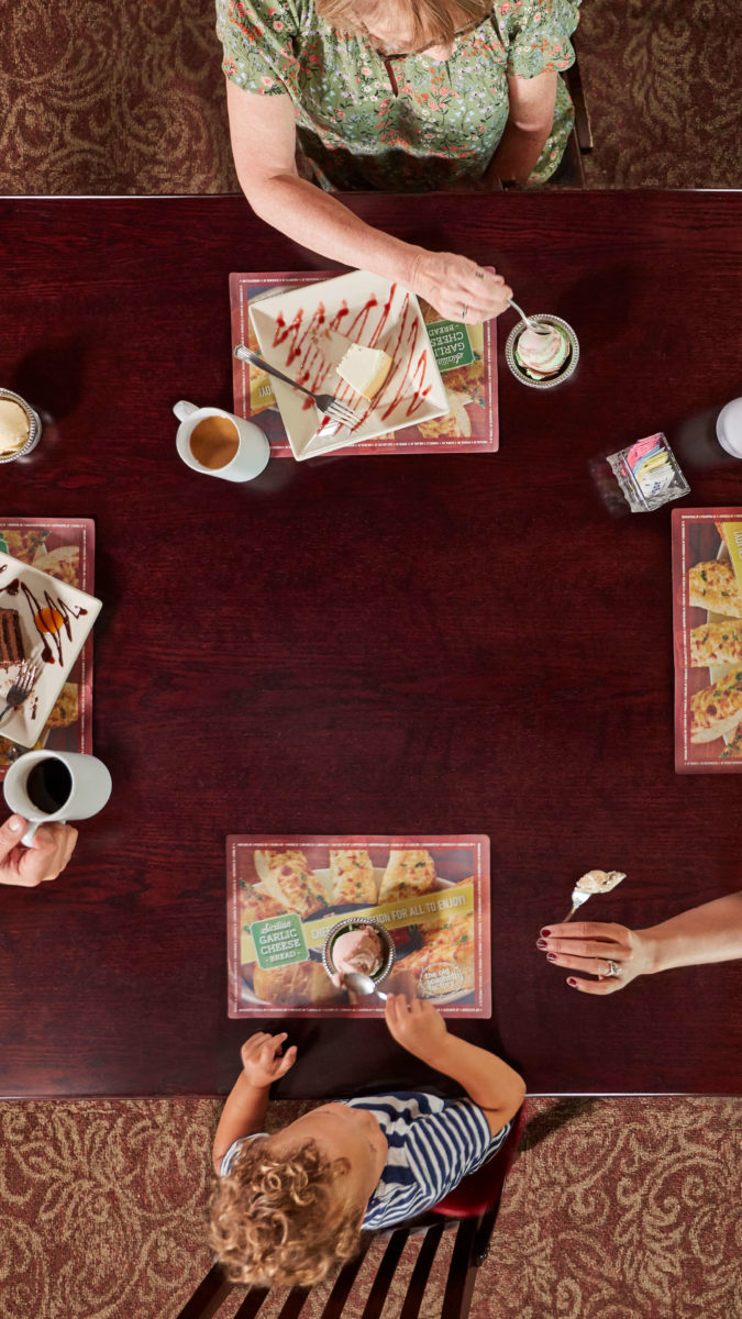 overhead view of family eating at Old Spaghetti Factory