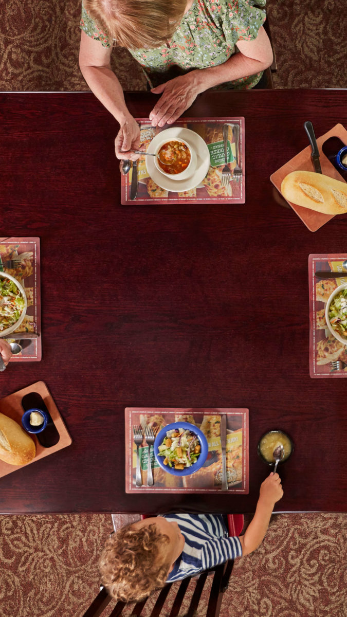 overhead view of family eating at Old Spaghetti Factory