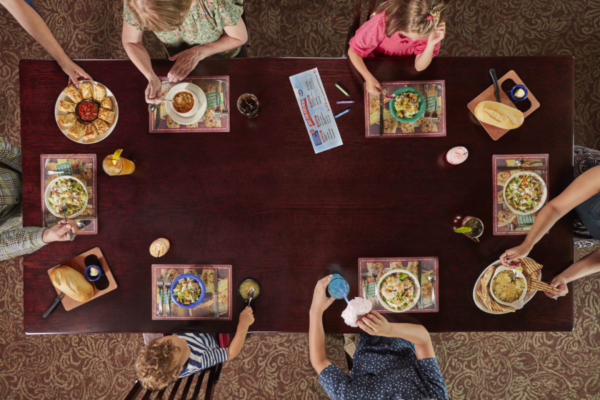 overhead view of family eating at Old Spaghetti Factory