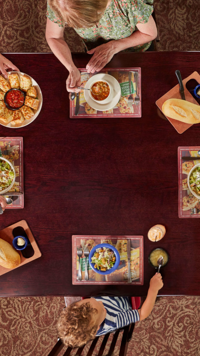 overhead view of family eating at Old Spaghetti Factory