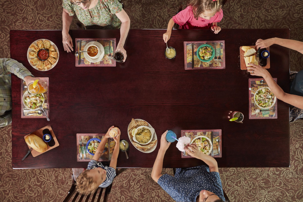 overhead view of family eating at Old Spaghetti Factory