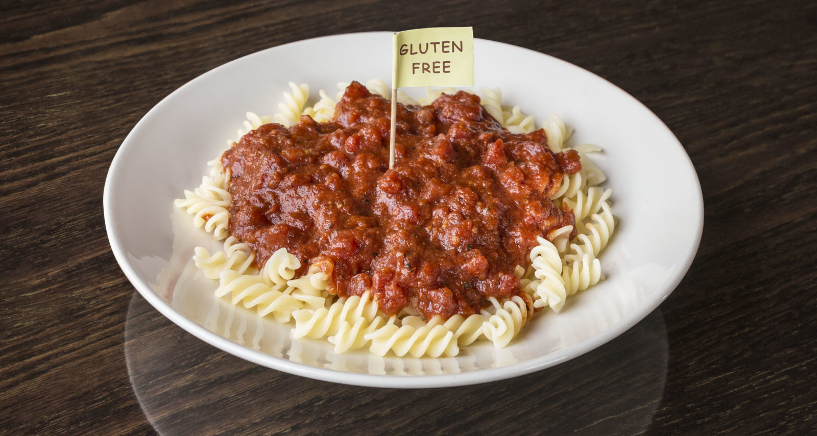 plate of gluten free pasta with "Gluten Free" flag.