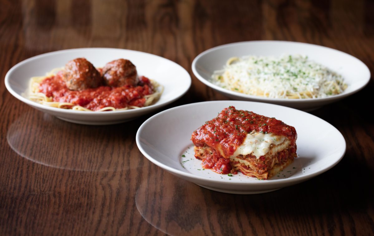 plates of The Old Spaghetti Factory's lasagna, spaghetti and meatballs, and mizithra pasta